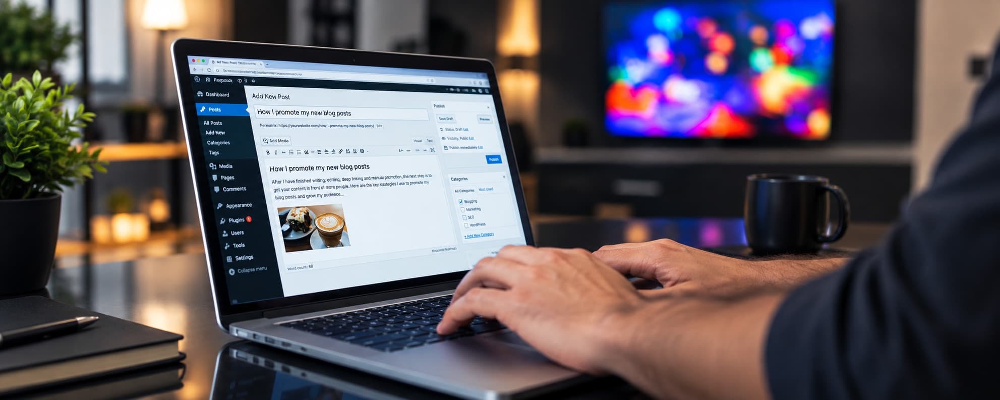 Hands typing a blog post on a laptop